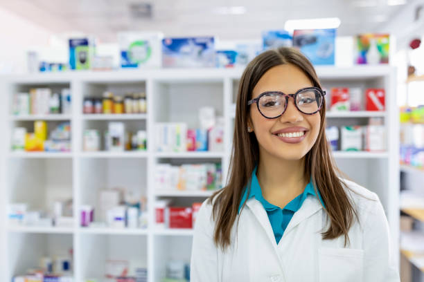 Portrait of a smiling healthcare worker in modern pharmacy